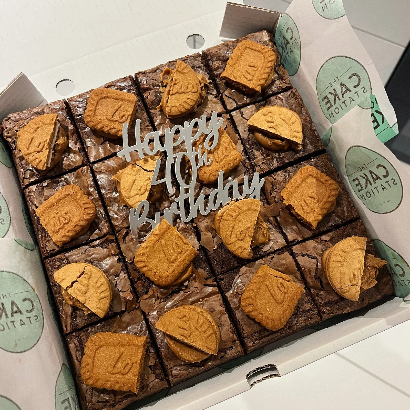Box of sixteen Biscoff-topped chocolate brownies with a Happy 40th Birthday topper