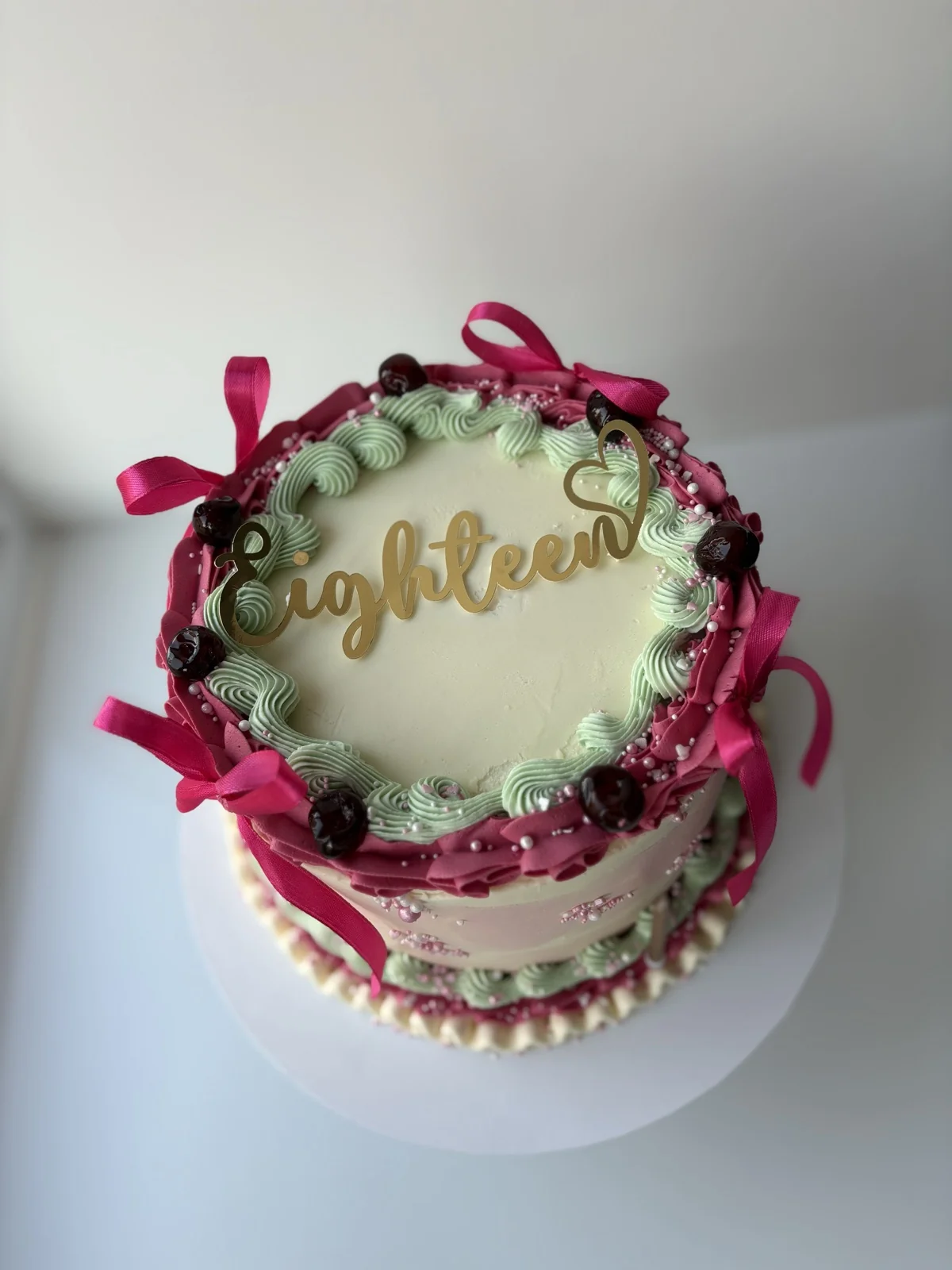 An elegant handcrafted 18th birthday celebration cake by The Cake Station