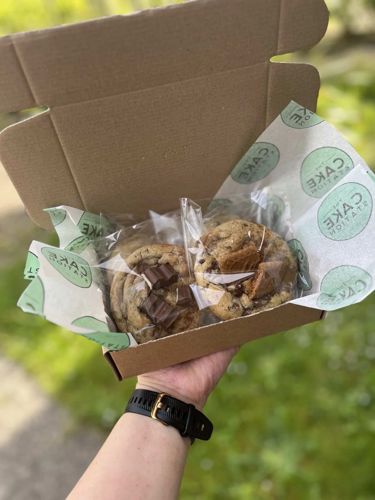 Two-cookie gift box wrapped in The Cake Station tissue paper