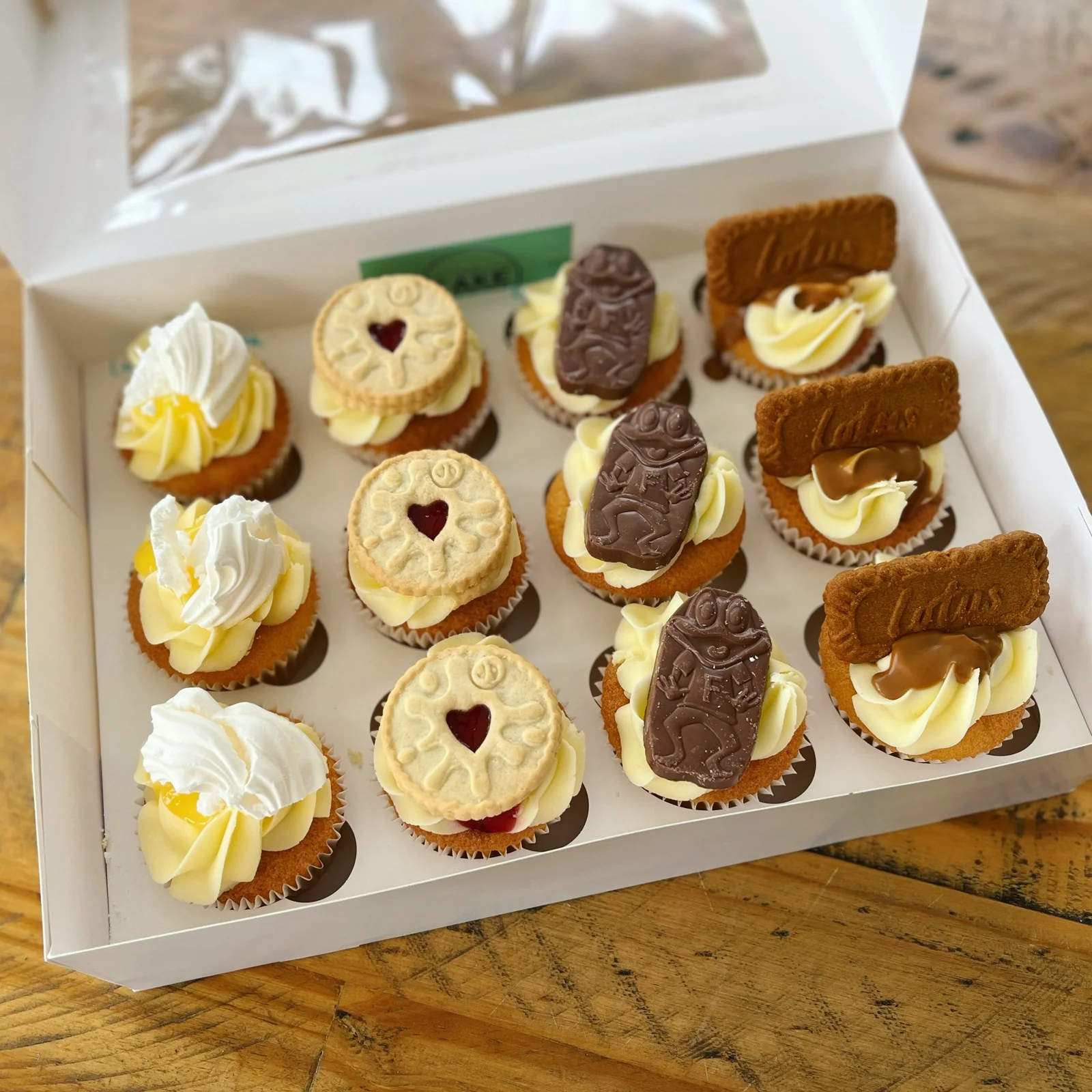 Gift box of twelve mixed cupcakes — lemon meringue, jammie dodger, Freddo and Biscoff flavours